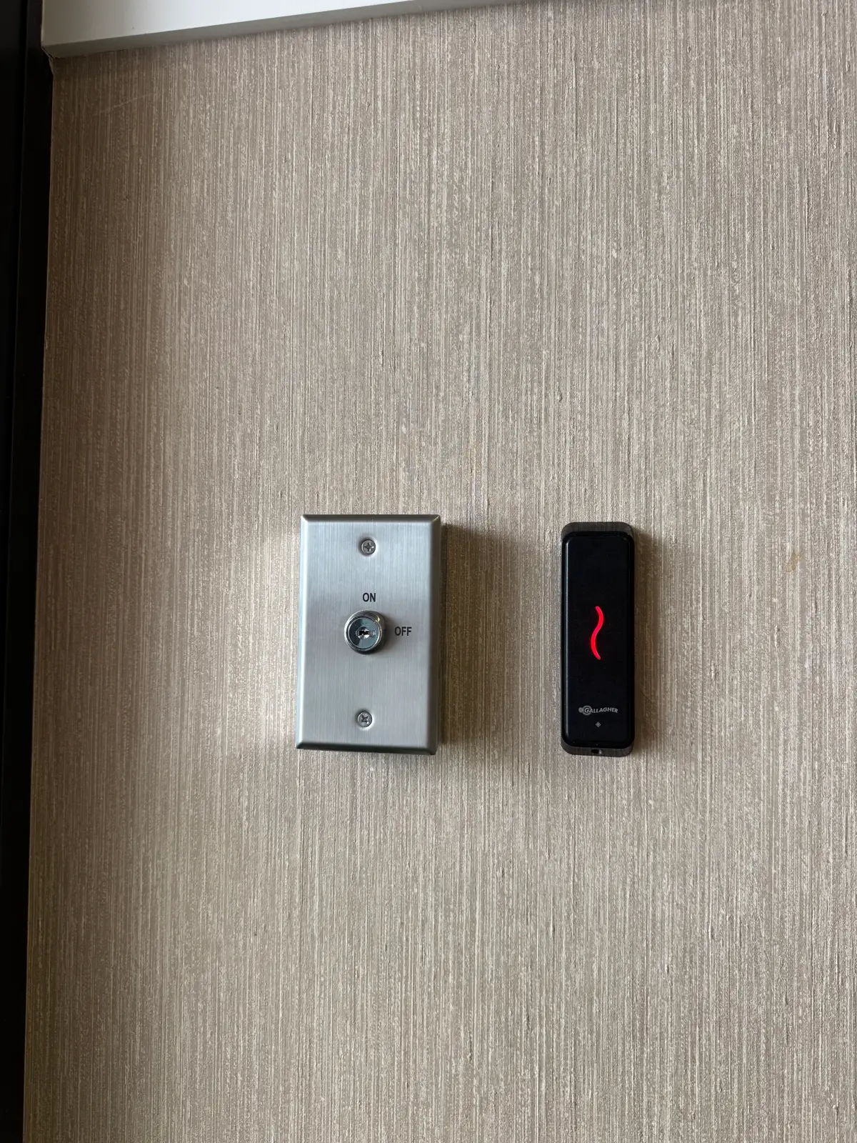Access control reader and exit button at an internal door on a Perth commercial site