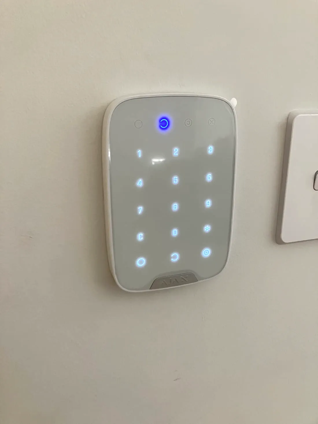Ajax keypad armed and glowing after a Perth alarm installation
