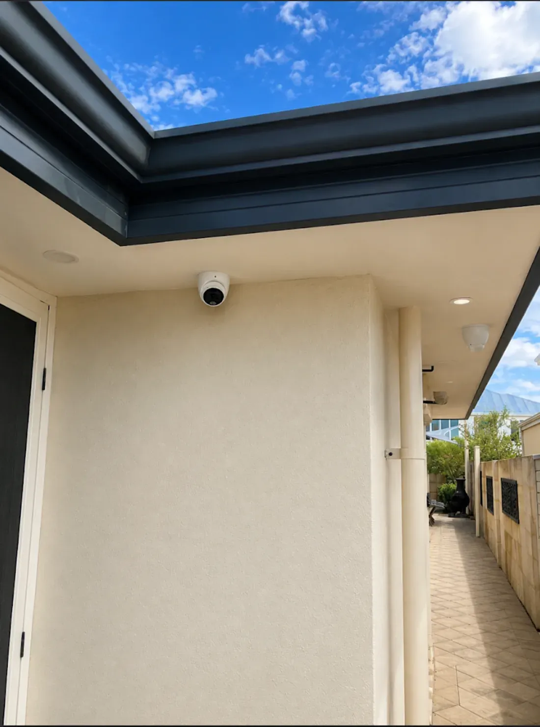 Turret camera covering a limestone side path on a Perth home