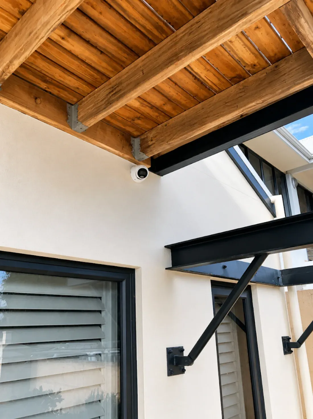 Dahua turret camera installed under the timber canopy of a Perth home