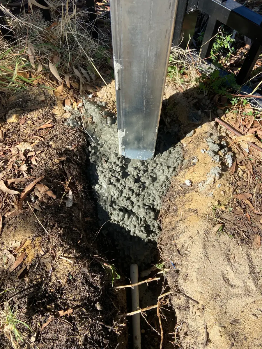 Concrete footing for a CCTV pole at a Perth site prepared for a compliant camera installation