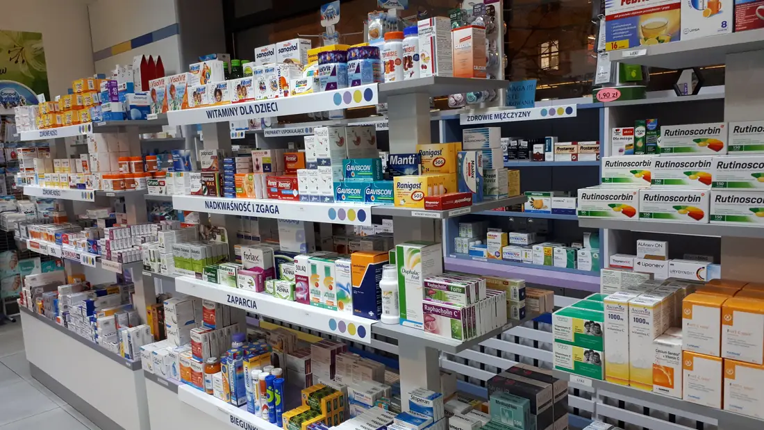 Modern pharmacy interior with stocked medicine shelves